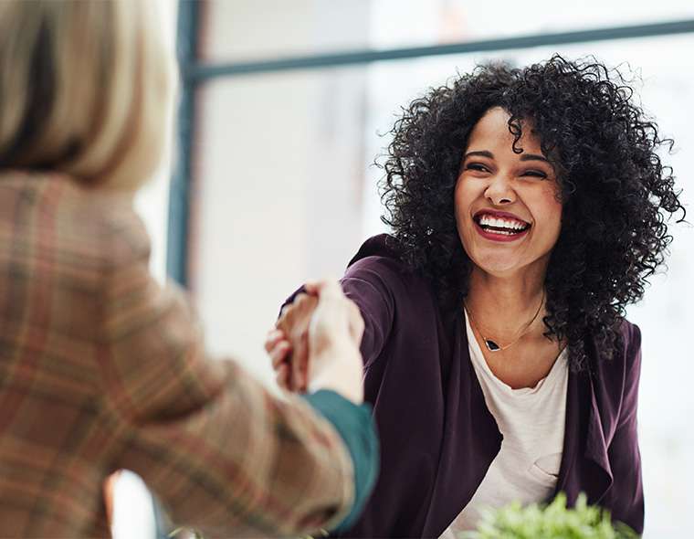 Talent Acquisition member shaking hands with an interviewee