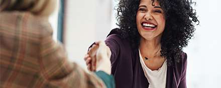 Talent Acquisition member shaking hands with an interviewee